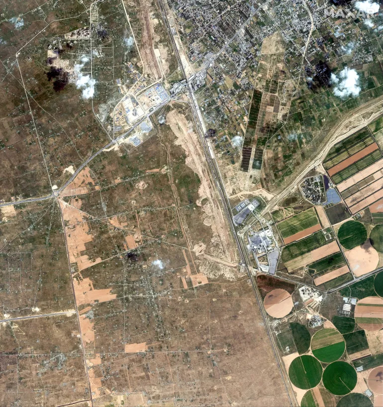 Satellite images provided by Maxar Technologies show construction process